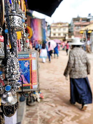 Tibetan singing bowl on a cushion with a wooden stricker