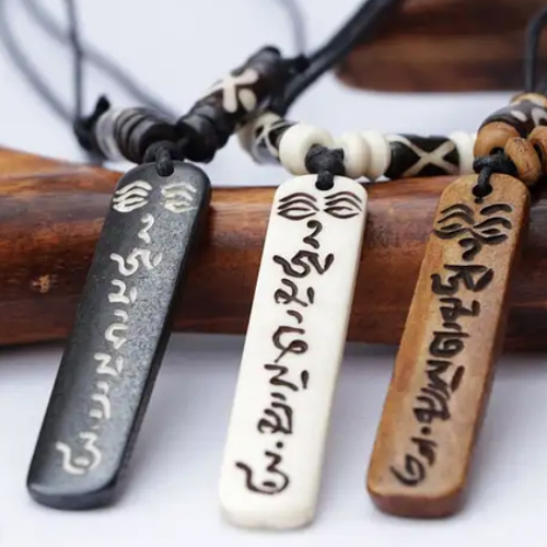 Carved yak bone Nepalese pendants