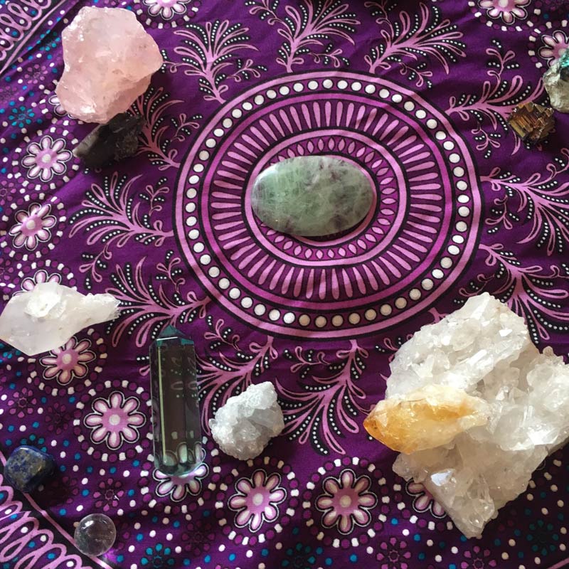 Crystal scattered on a bohemian style table cloth