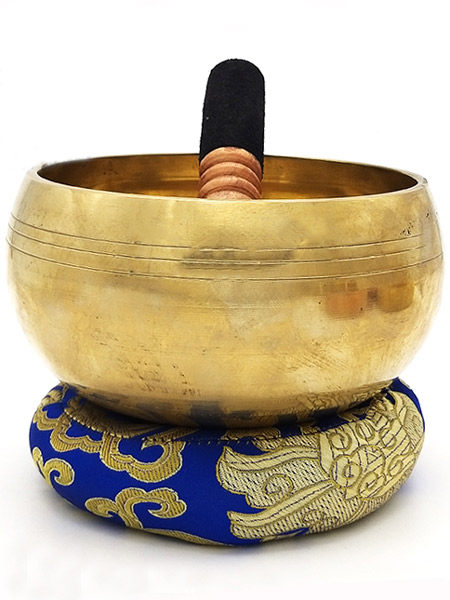 Tibetan singing bowl on a cushion