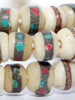 White bone mala, inlaid with turquoise and coral powder, as well as copper.
