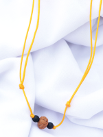 Handcrafted Rudraksha seed bracelet and necklace set with matte onyx and rudraksha beads on an adjustable black cord, displayed on a fabric background.